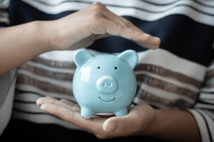 Piggy bank wearing glasses representing financial savings